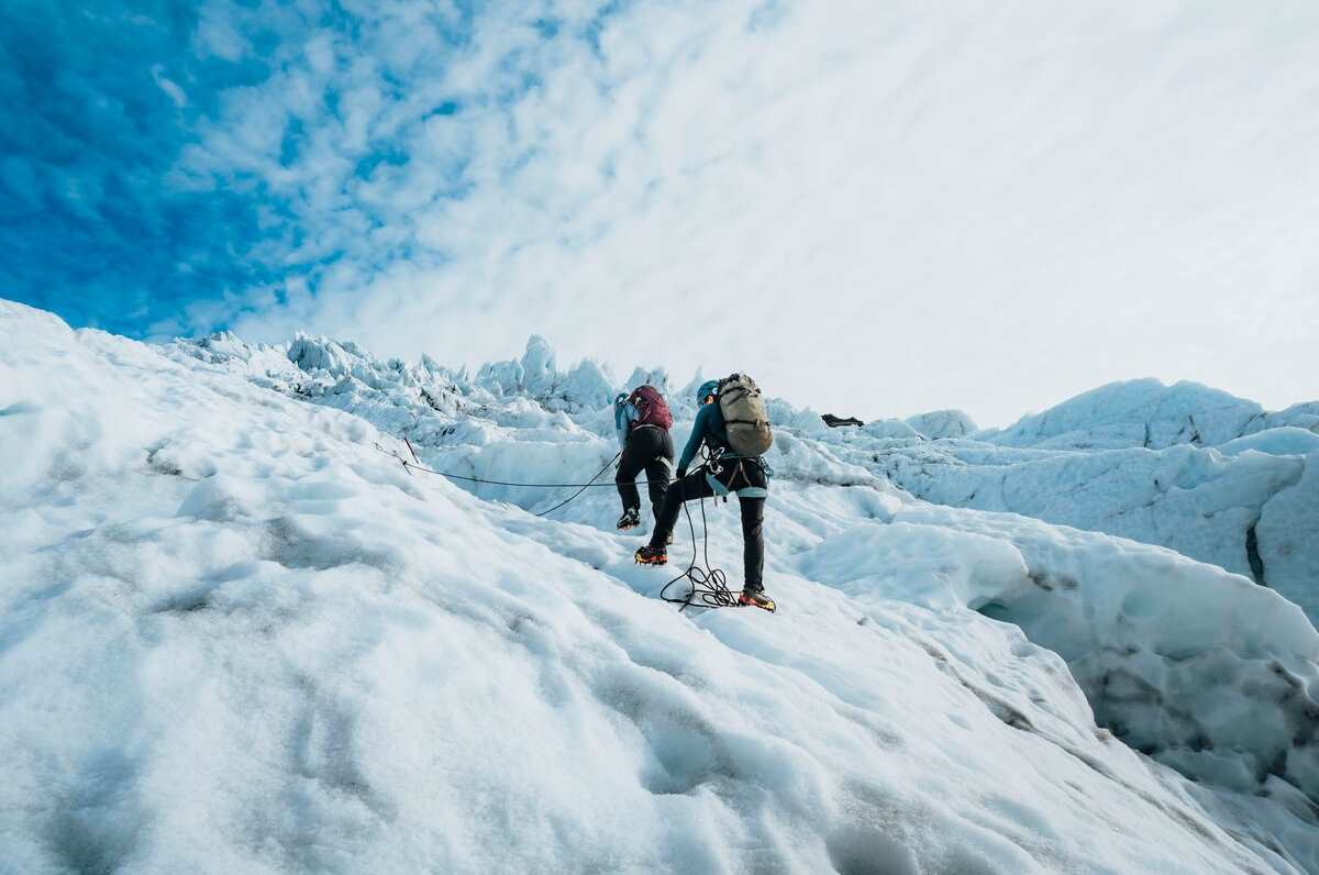 Ice wall climbing at falljokull glacier tour group