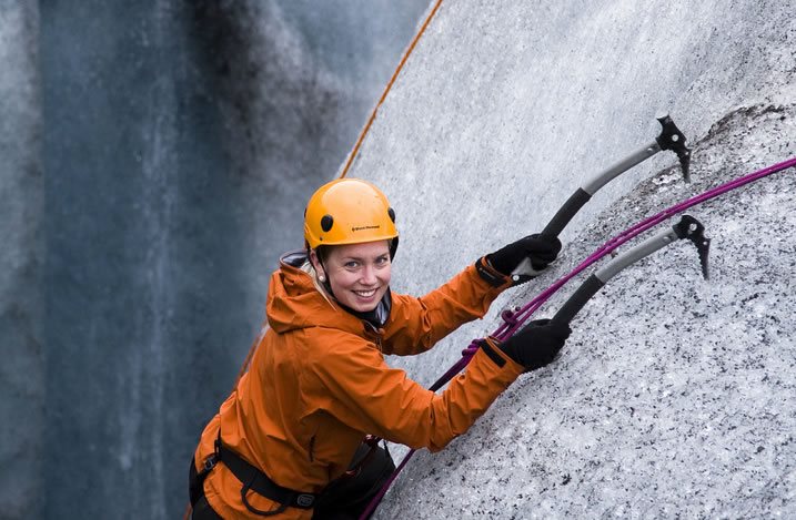 Girl Ice climbing tour in Iceland
