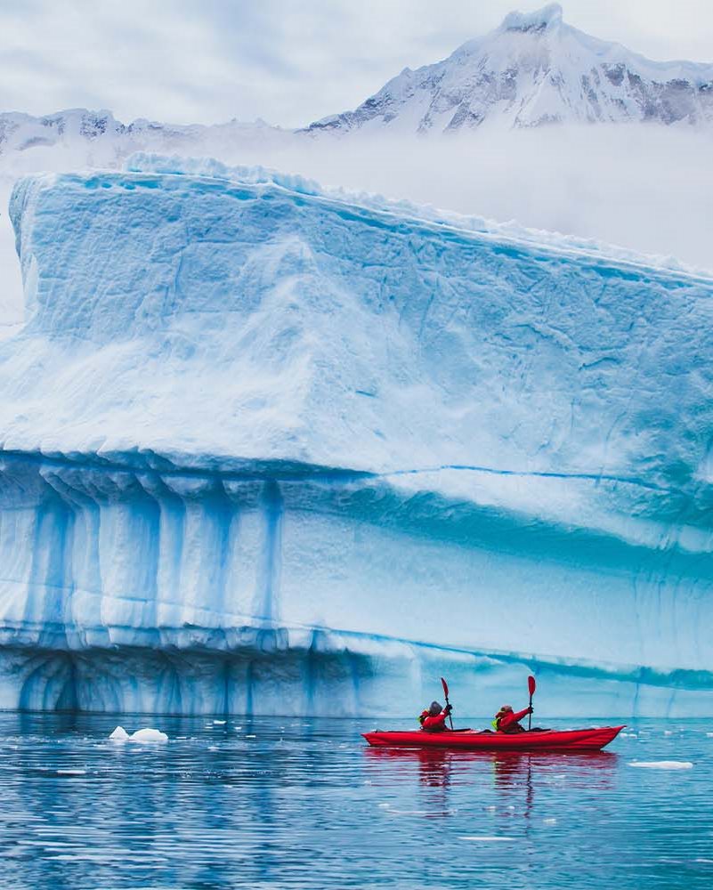Glacier kayaking tour in a glacier lagoon in Iceland 