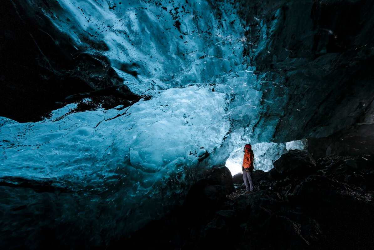 MAle inside newly discovered ice cave by Solheimajokull glacier.
