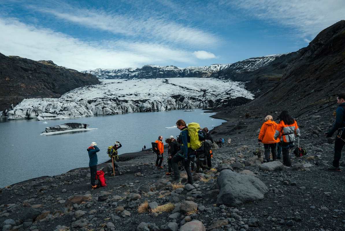 Small group hiking on Solheimajokull glacier.