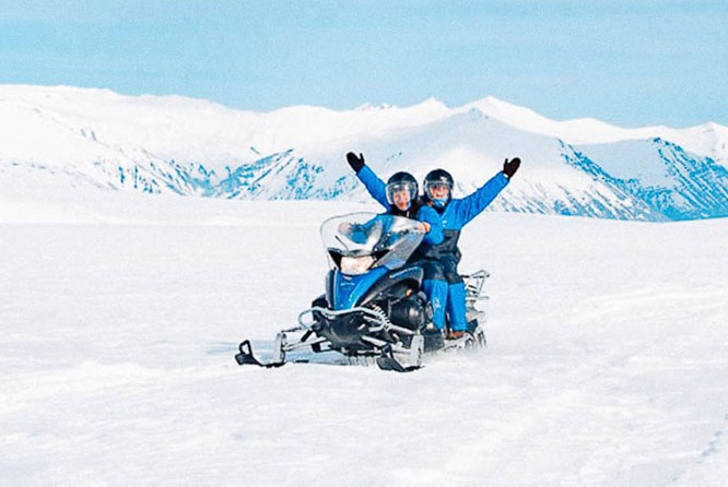 Snowmobile on Vatnajokull Glacier in Iceland  Snowmobile on Vatnajokull Glacier in Iceland