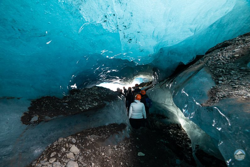 A group of glacier hikers inside the cave