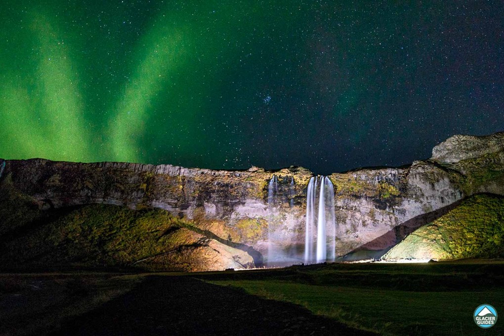 Seljalandsfoss Waterfall And Northern Lights At Night
