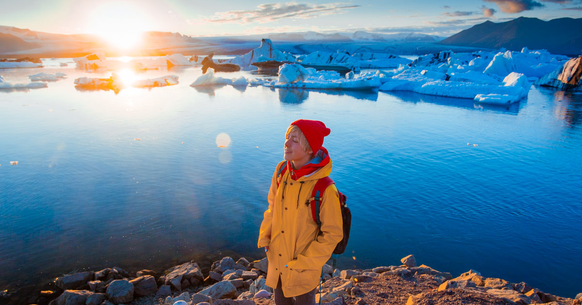 Girl In Jokulsarlon Glacier Lagoon On Sunny Day