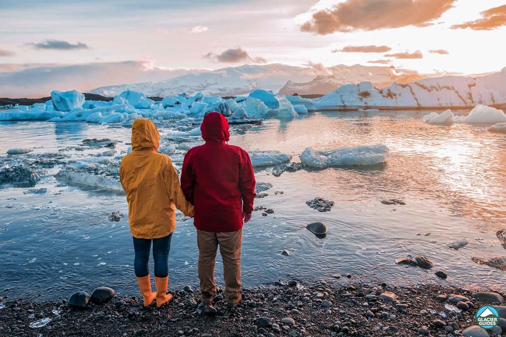 Couple At Jokulsarlon Glacier Lagoon Iceland