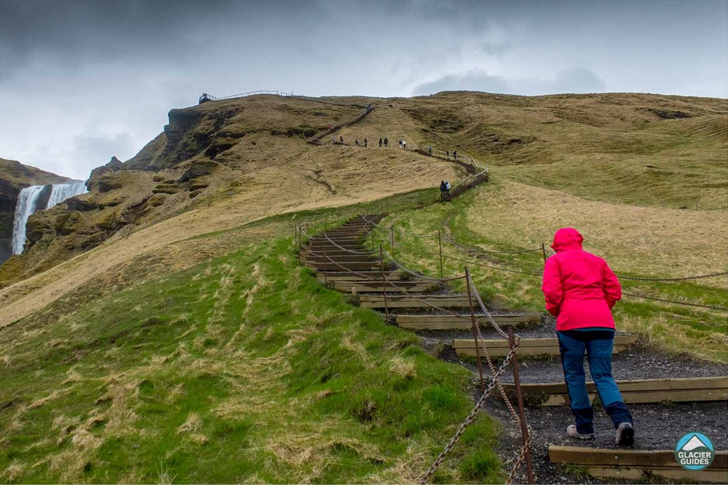 Tourist On Staircase In Skogafoss