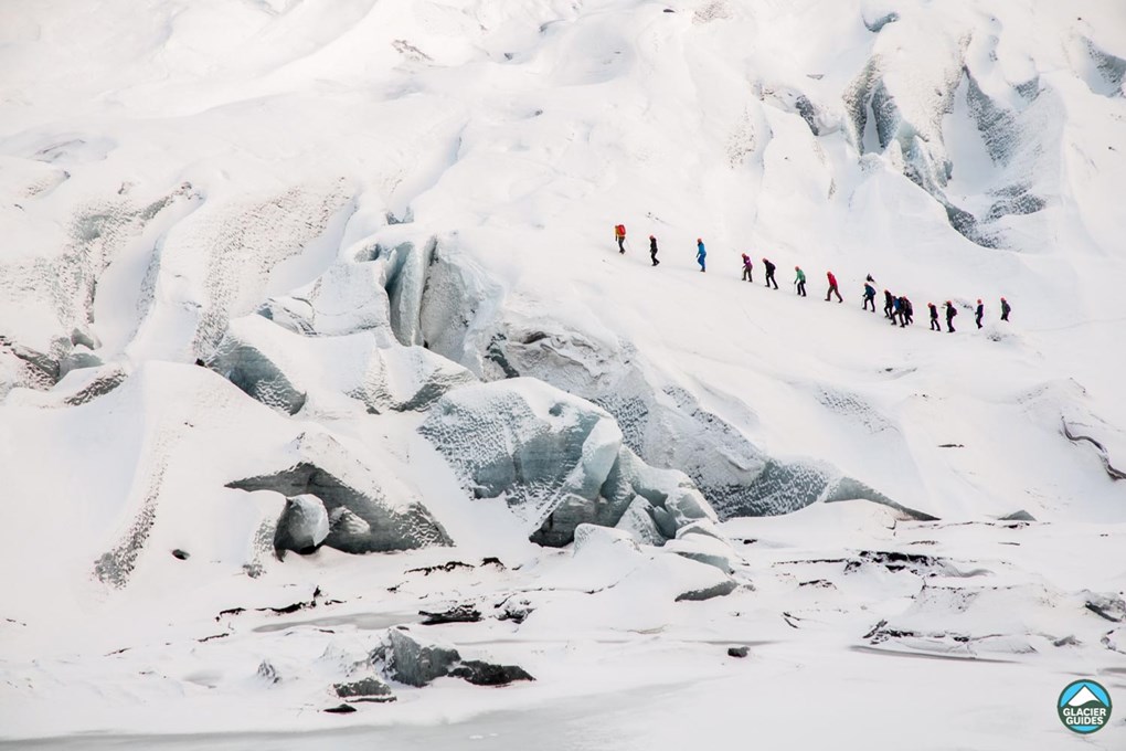 Hikers climbing on Solheimajokull Glacier