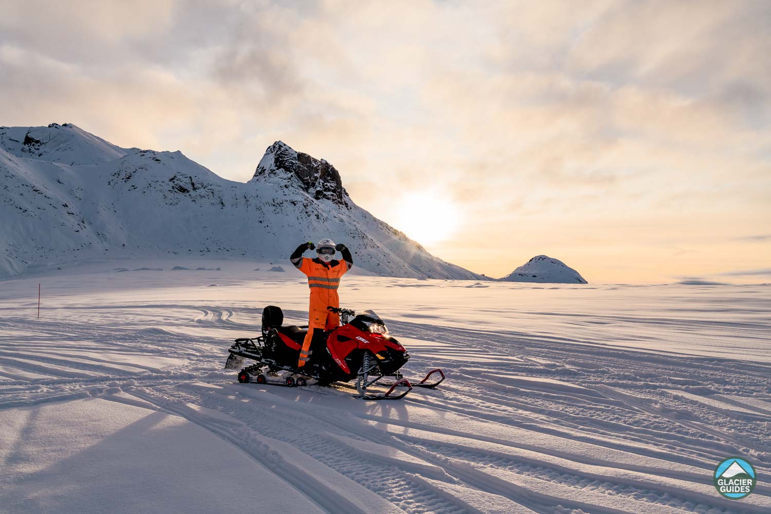 Person In Orange Suit On Glacier Iceland