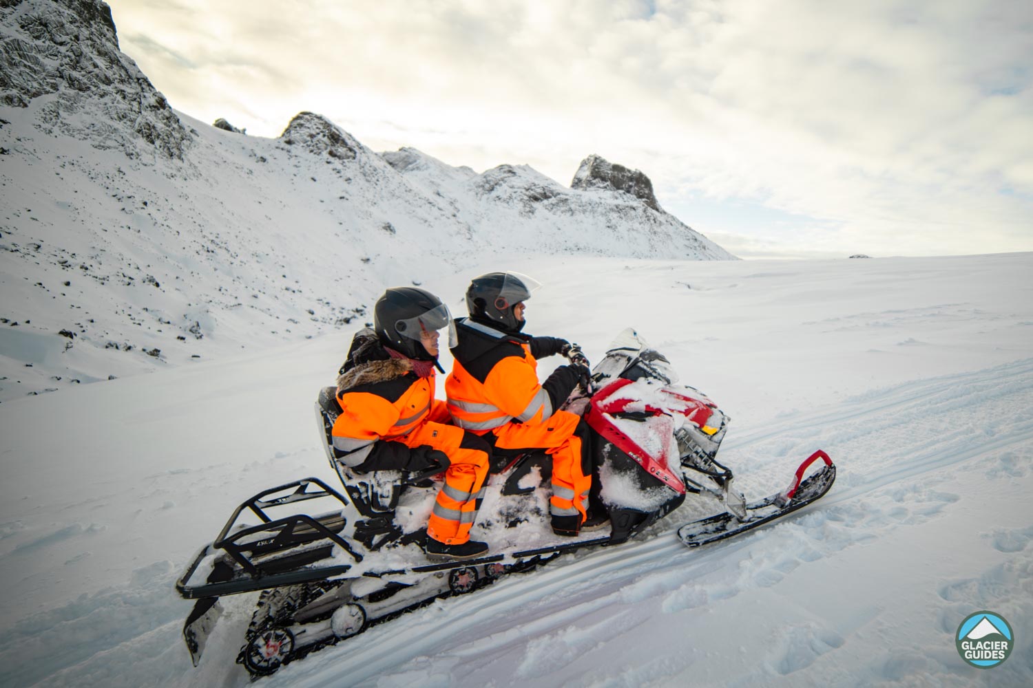 Two Person Snowmobile On Glacier In Iceland