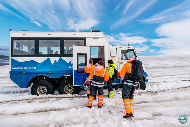 Group of people getting into the super truck in Iceland