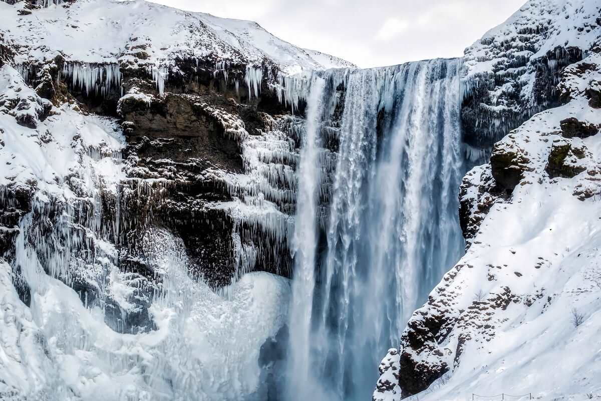 Skogafoss waterfall covered in snow in iceland