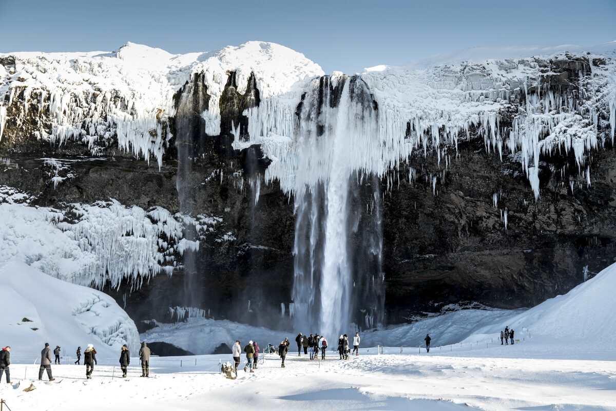 Seljalandsfoss waterfall and tourists during winter in iceland
