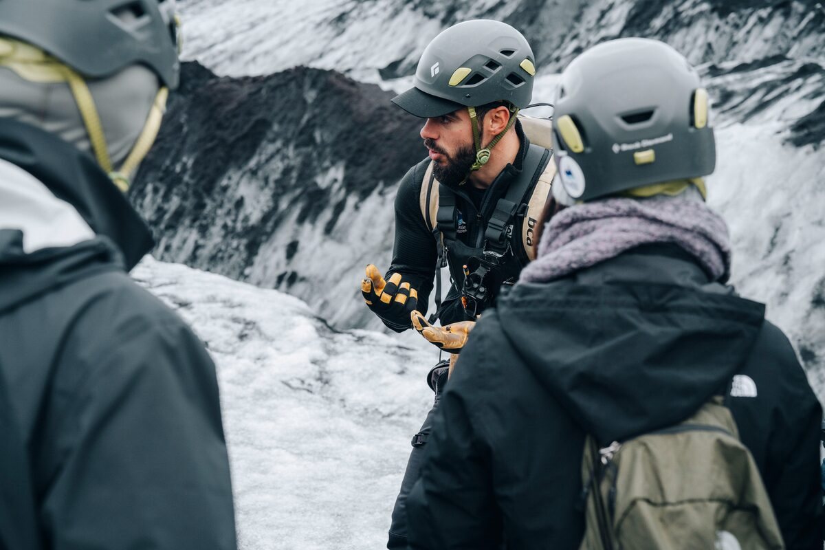 guide explaining things on solheimajokull glacier in iceland