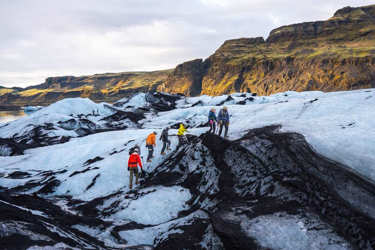 group of tourists on a blue ice glacier hike in iceland