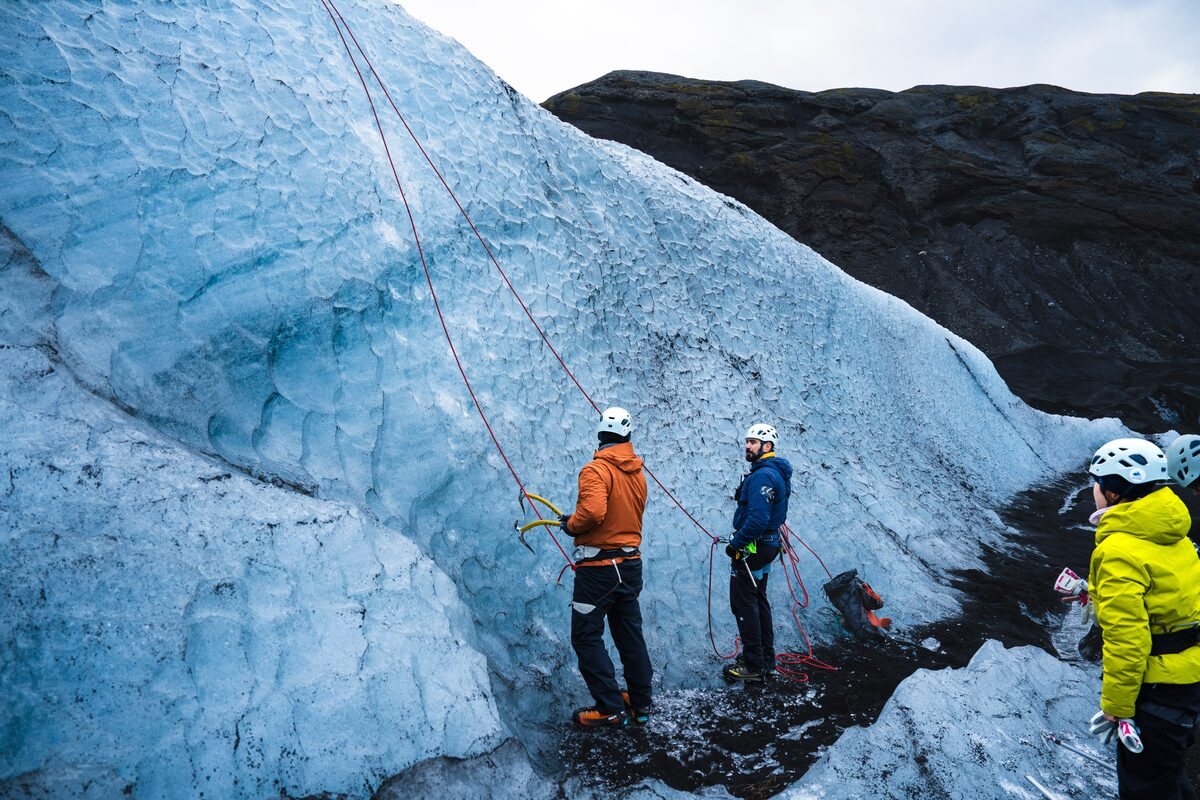 tourists getting ready to ice climb in iceland